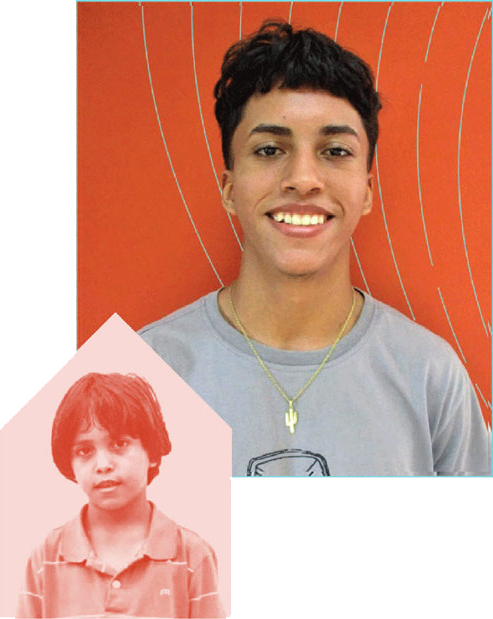 a young boy smiling to the camera