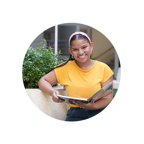 young girl reading a book