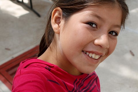 Karen gives a winning smile for her selfie.