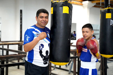a boy and his coach boxing